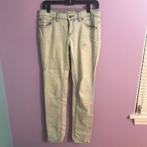 Free People light wash skinny jeans with rips